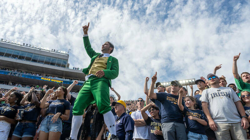 The Leprechaun leads the student section in cheering at the home opener against Marshall