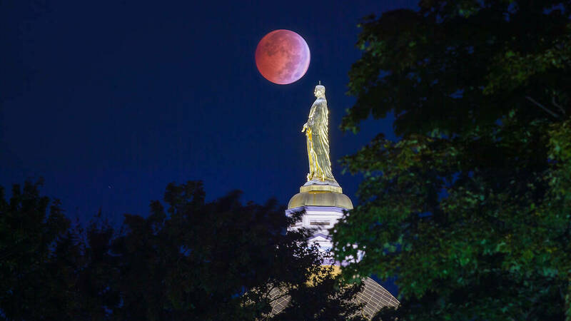 Golden Dome in front of the lunar eclipse also referred to as a blood moon